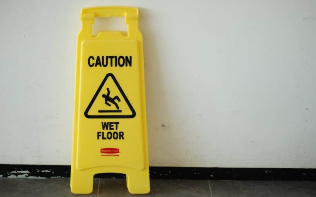 Slip & Fall cases in Minnesota: image of a cautionary wet floor sign.