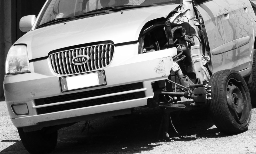 Image of a badly damaged sedan after a car accident.