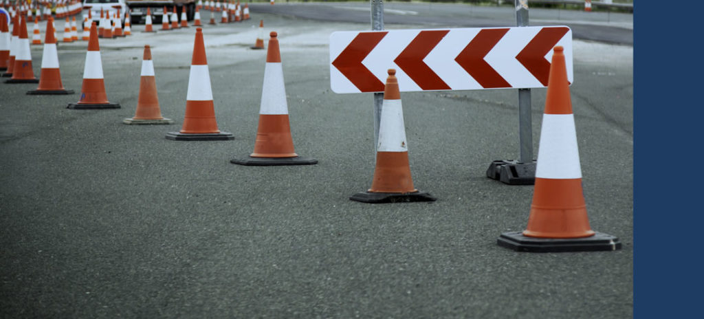 Traffic cones marking where a construction zone is located.