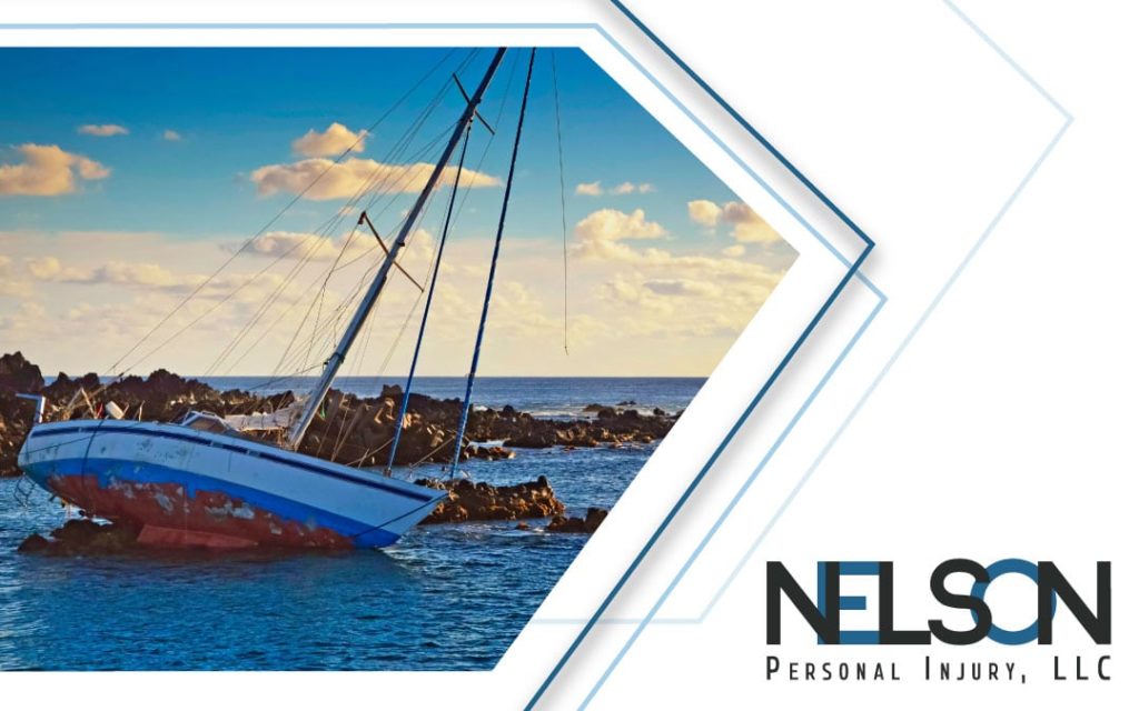 Image of a sailboat that has sustained damage with Nelson Personal Injury, LLC logo
