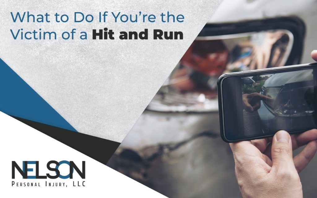 A person taking a photo of a car accident using a smartphone with text "What to do if you're the victim of a hit and run" with Nelson Personal Injury, LLC logo