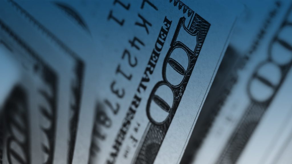 Close up image of multiple $100 bills fanned out