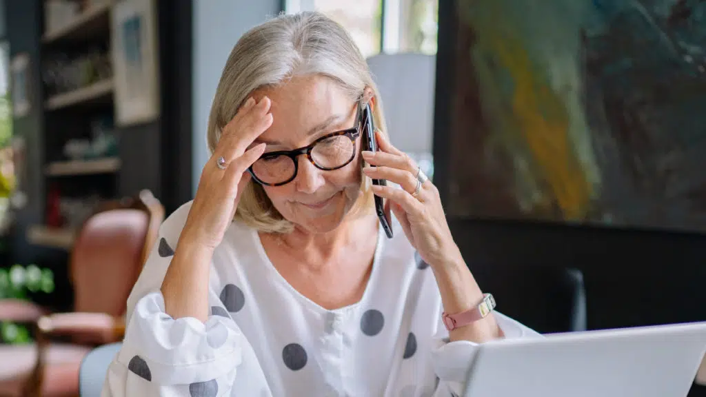 A woman on the phone discussing claims with an attorney