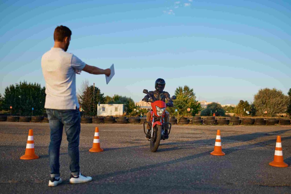 Rider practicing cones for motorcycle license Minneapolis training